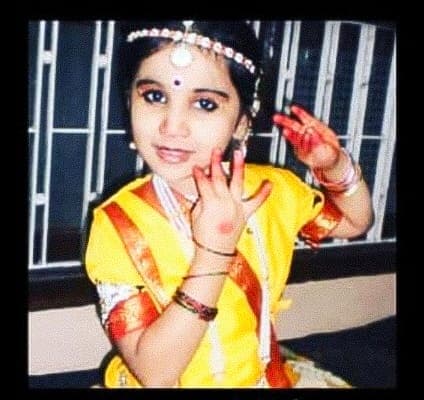 Young Niral in yellow traditional outfit